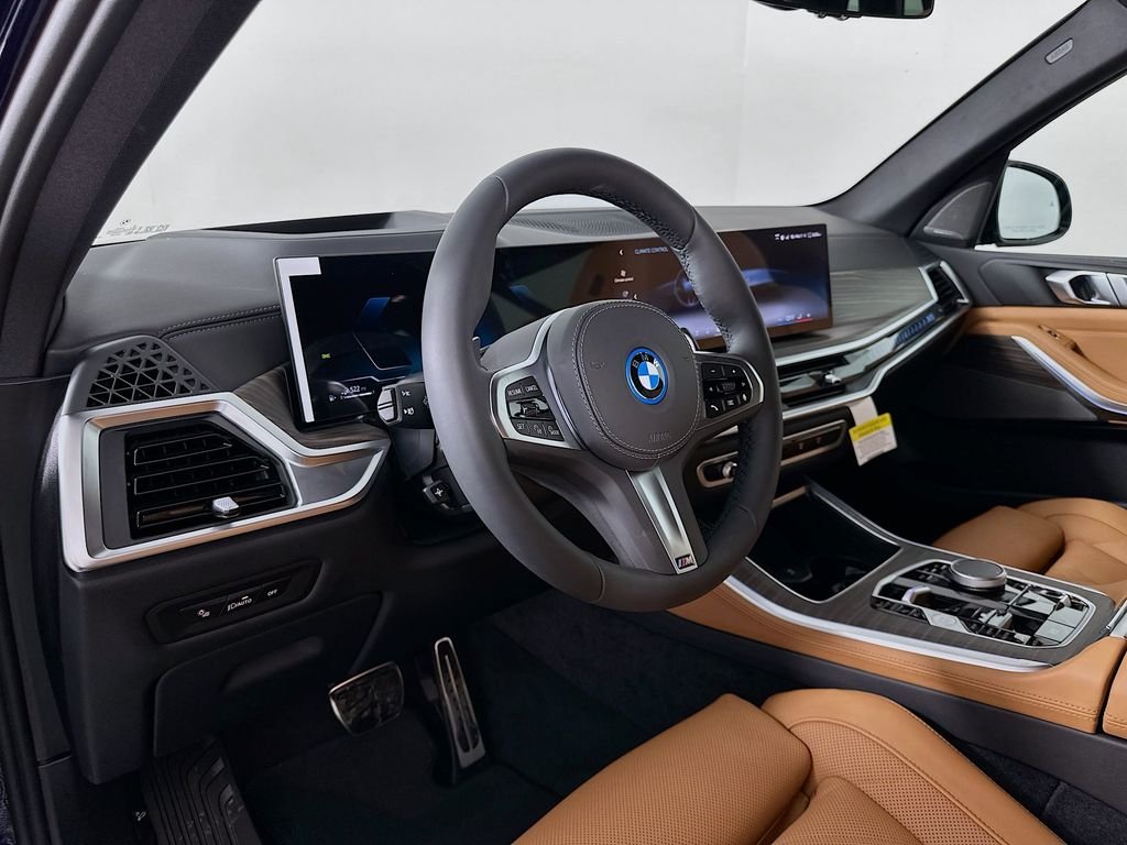 Used 2026 Tanzanite Blue II Metallic BMW xDrive50e image 9
