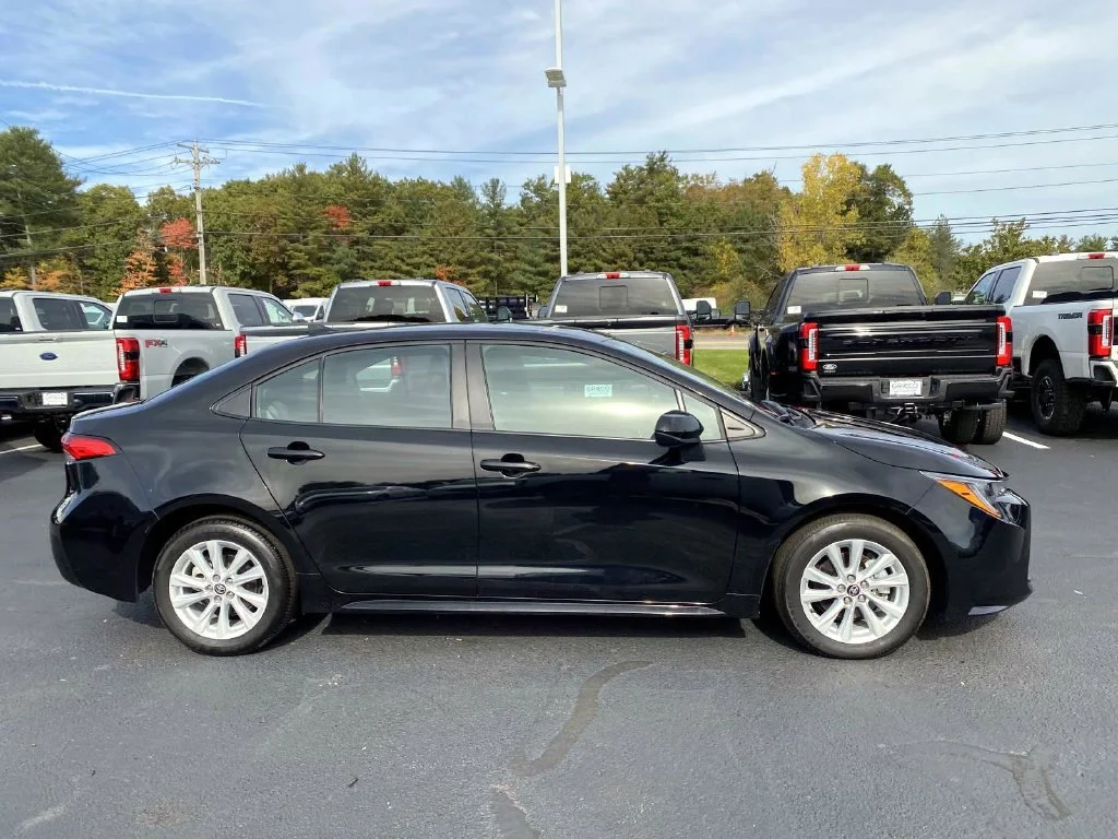 Used 2025 Midnight Black Metallic Toyota LE image 2