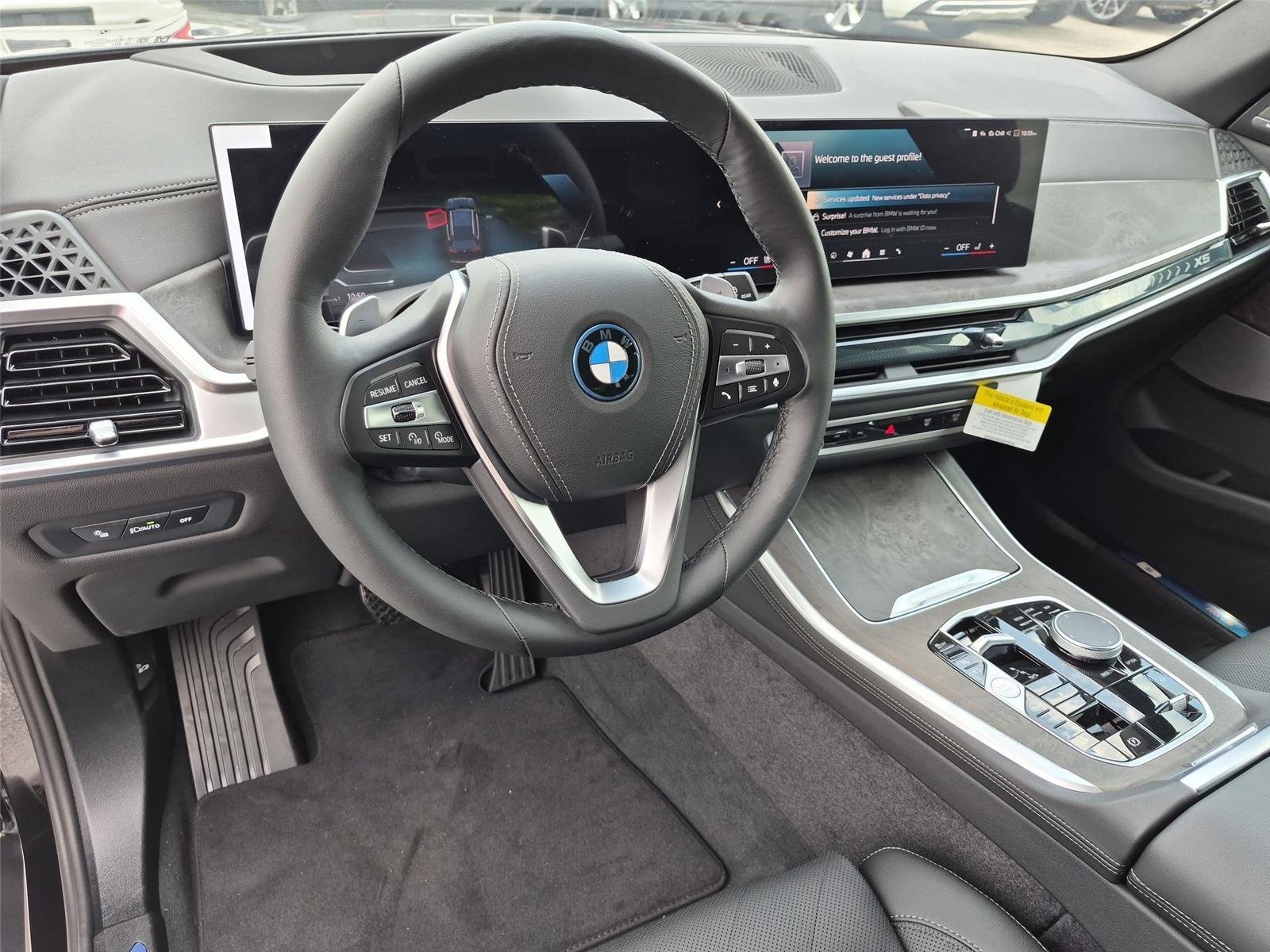 New 2026 Black Sapphire Metallic BMW xDrive50e image 19