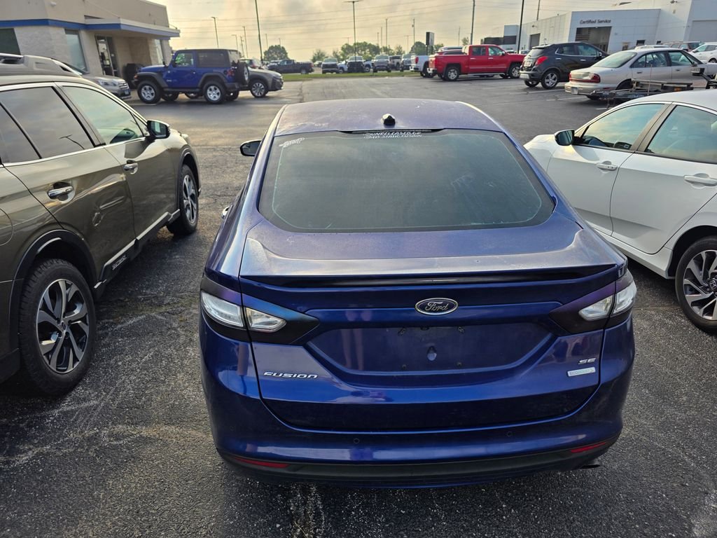 Used 2016 Deep Impact Blue Ford SE image 3