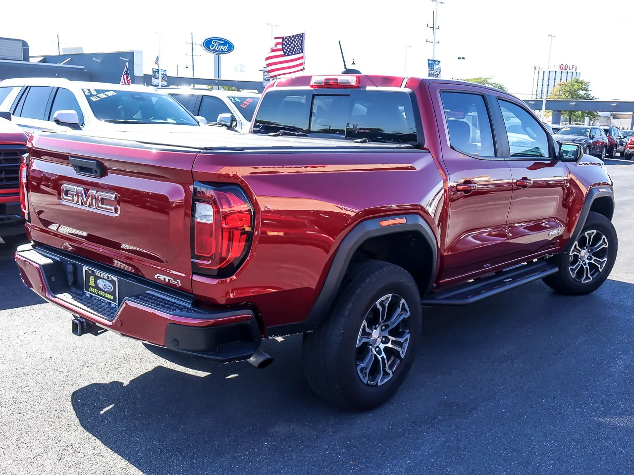 Used 2024 Volcanic Red Tintcoat GMC 4WD AT4 image 7