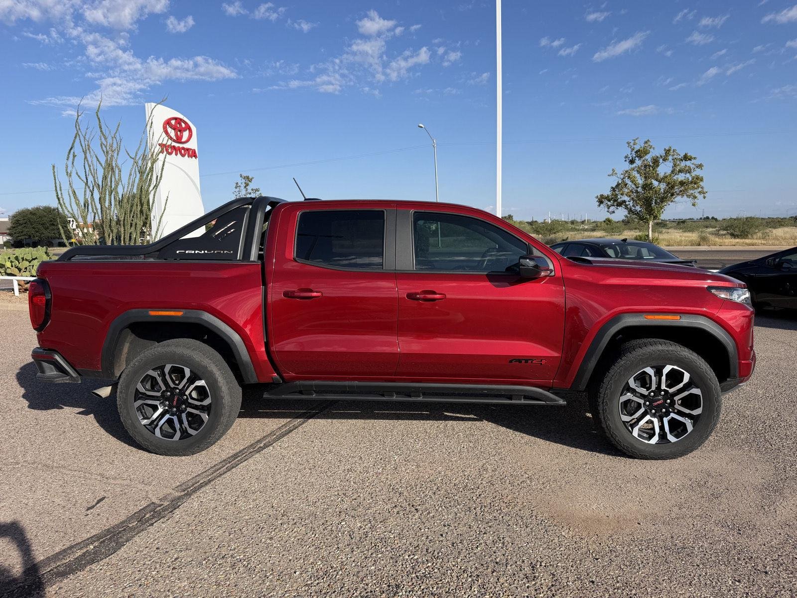 Used 2025 Volcanic Red Tintcoat GMC 4WD AT4 image 7