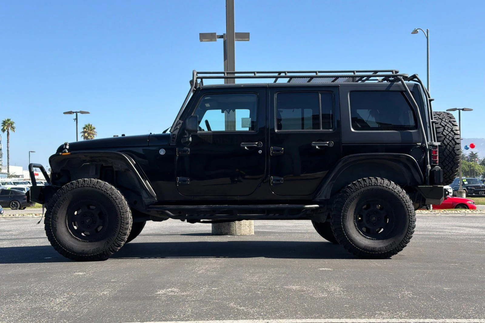 Used 2013 Black Jeep Unlimited Sport image 7