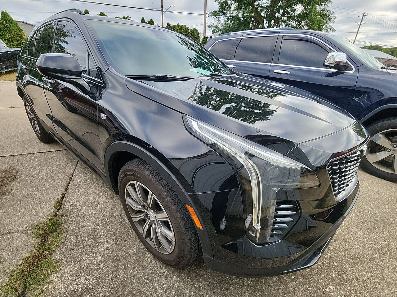 Used 2019 Black Cadillac Sport image 1