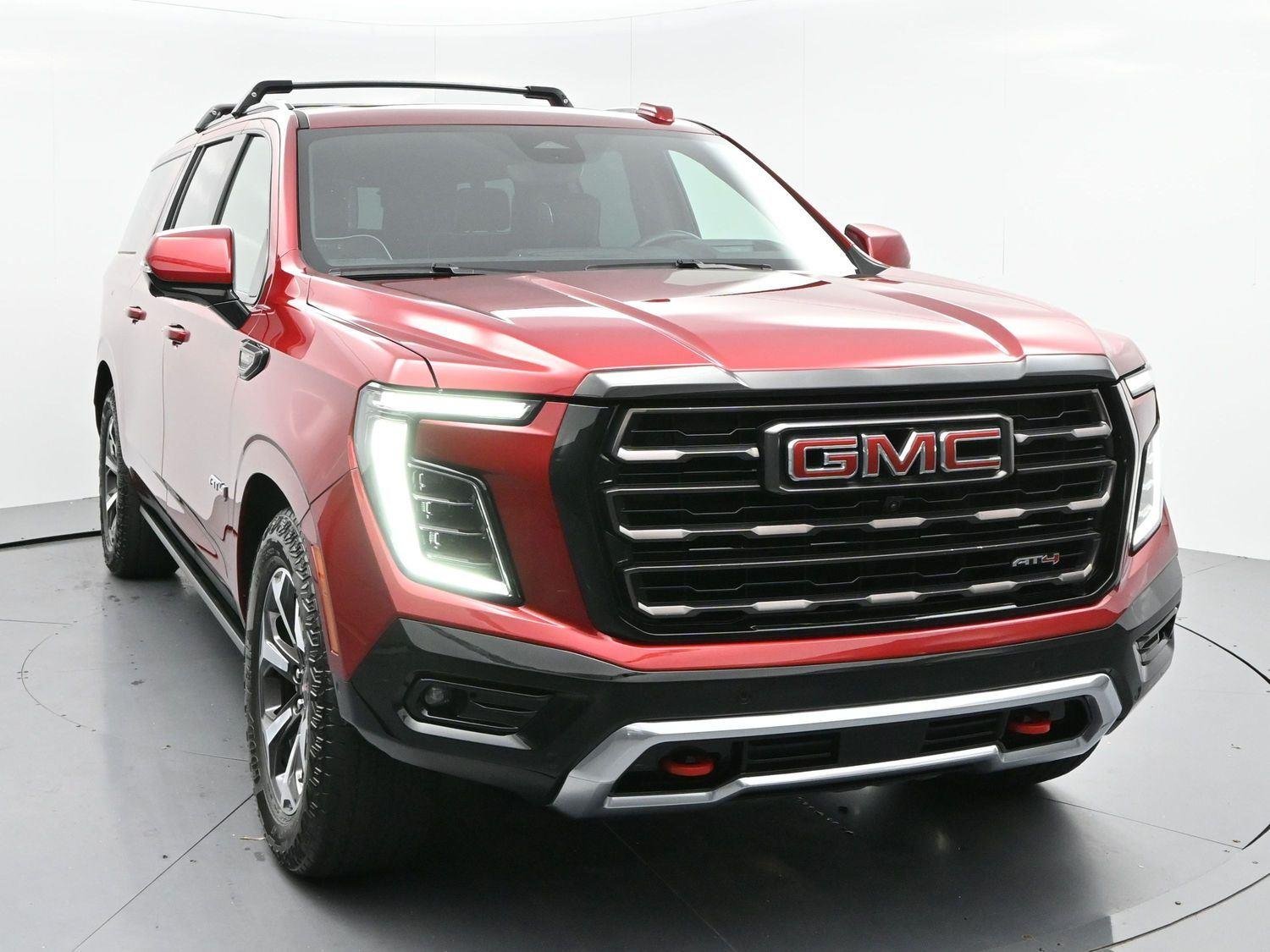 Used 2025 Volcanic Red Tintcoat GMC AT4 Ultimate image 2