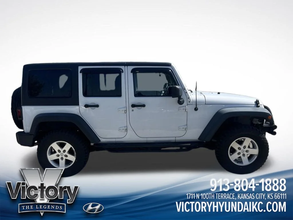 Used 2013 White Jeep Unlimited Sport image 4