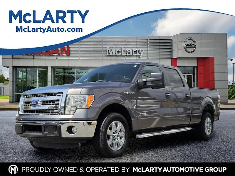 Used 2014 Sterling Gray Metallic FORD 2WD SUPERCREW 145" XLT image 1