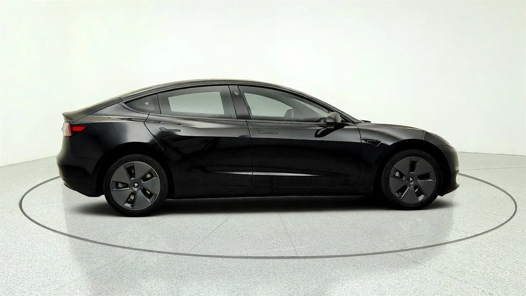 Used 2023 Solid Black Tesla RWD image 4