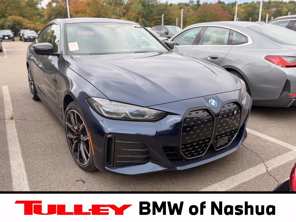 Used 2024 Tanzanite Blue II Metallic BMW eDrive35 image 1