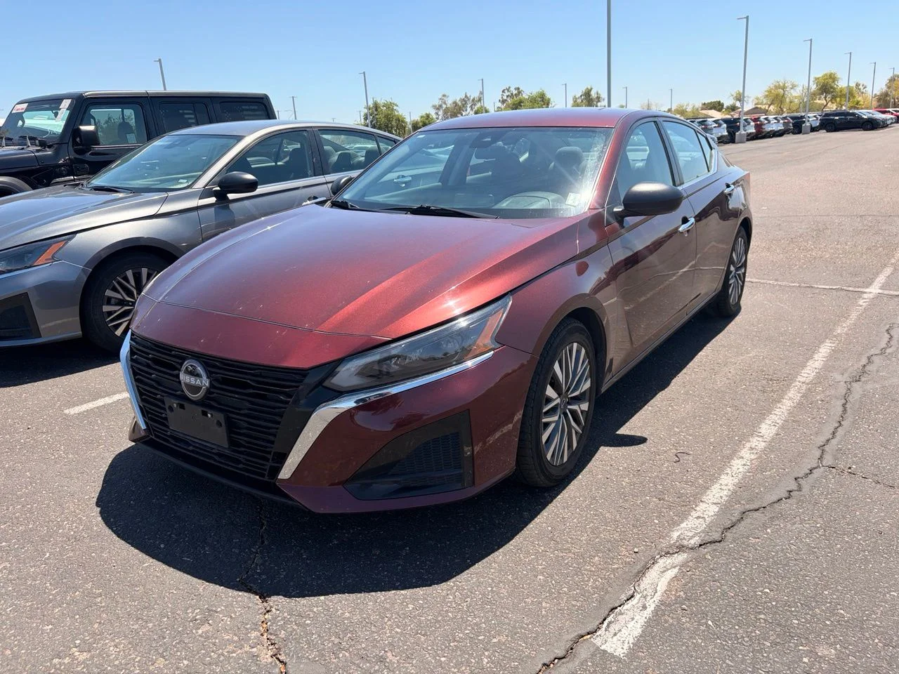 Used 2024 Garnet Pearl Metallic Nissan 2.5 SV image 1