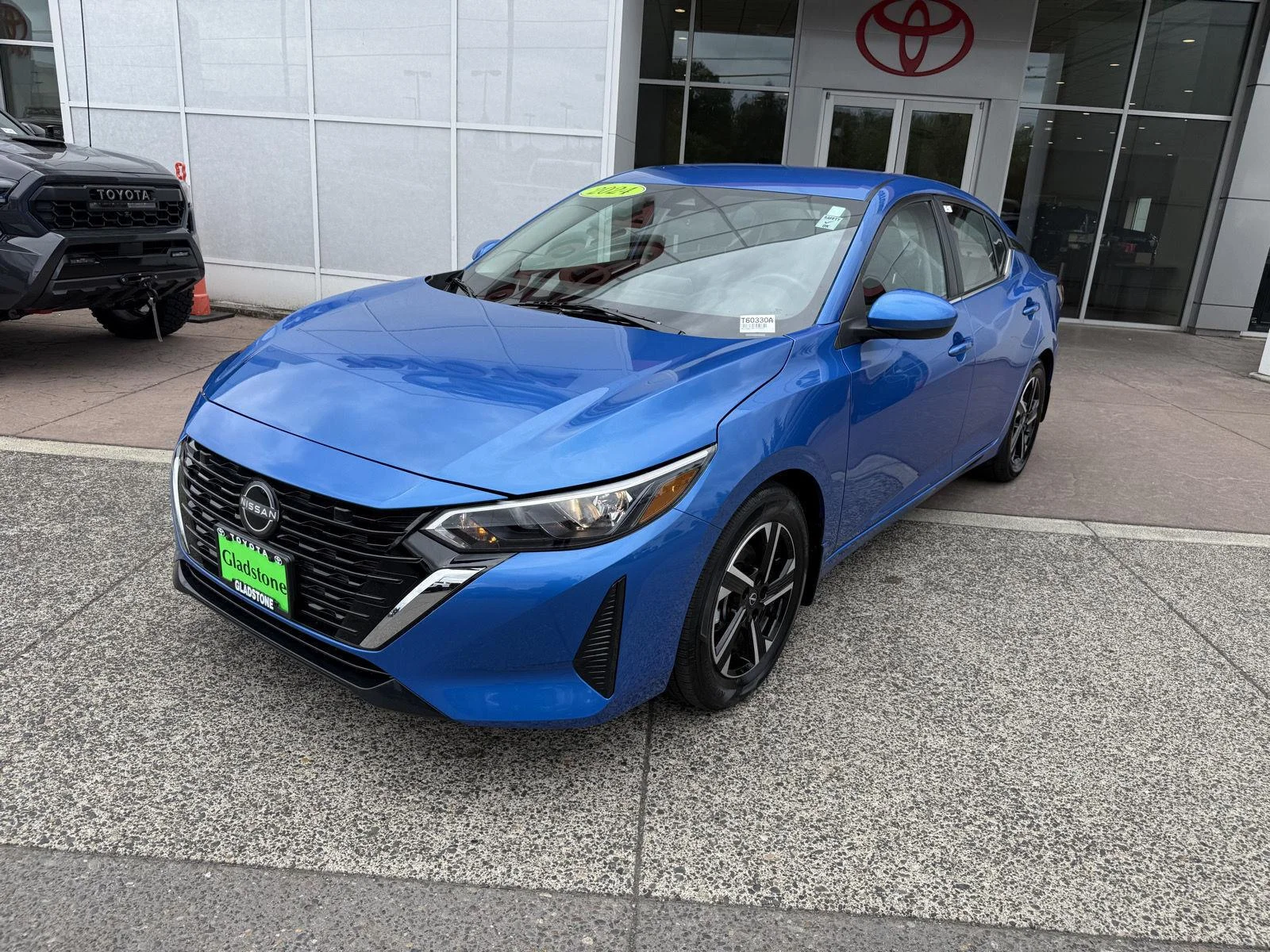 Used 2024 Electric Blue Metallic Nissan SV image 2