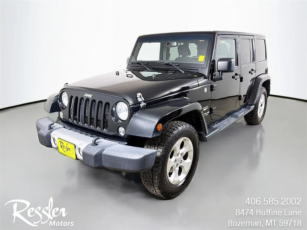 Used 2015 Black Jeep Unlimited Sahara image 1