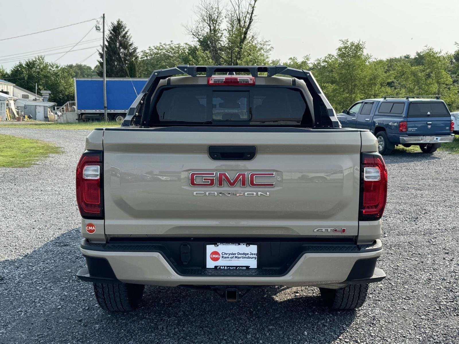 Used 2023 Desert Sand Metallic GMC 4WD AT4 image 23