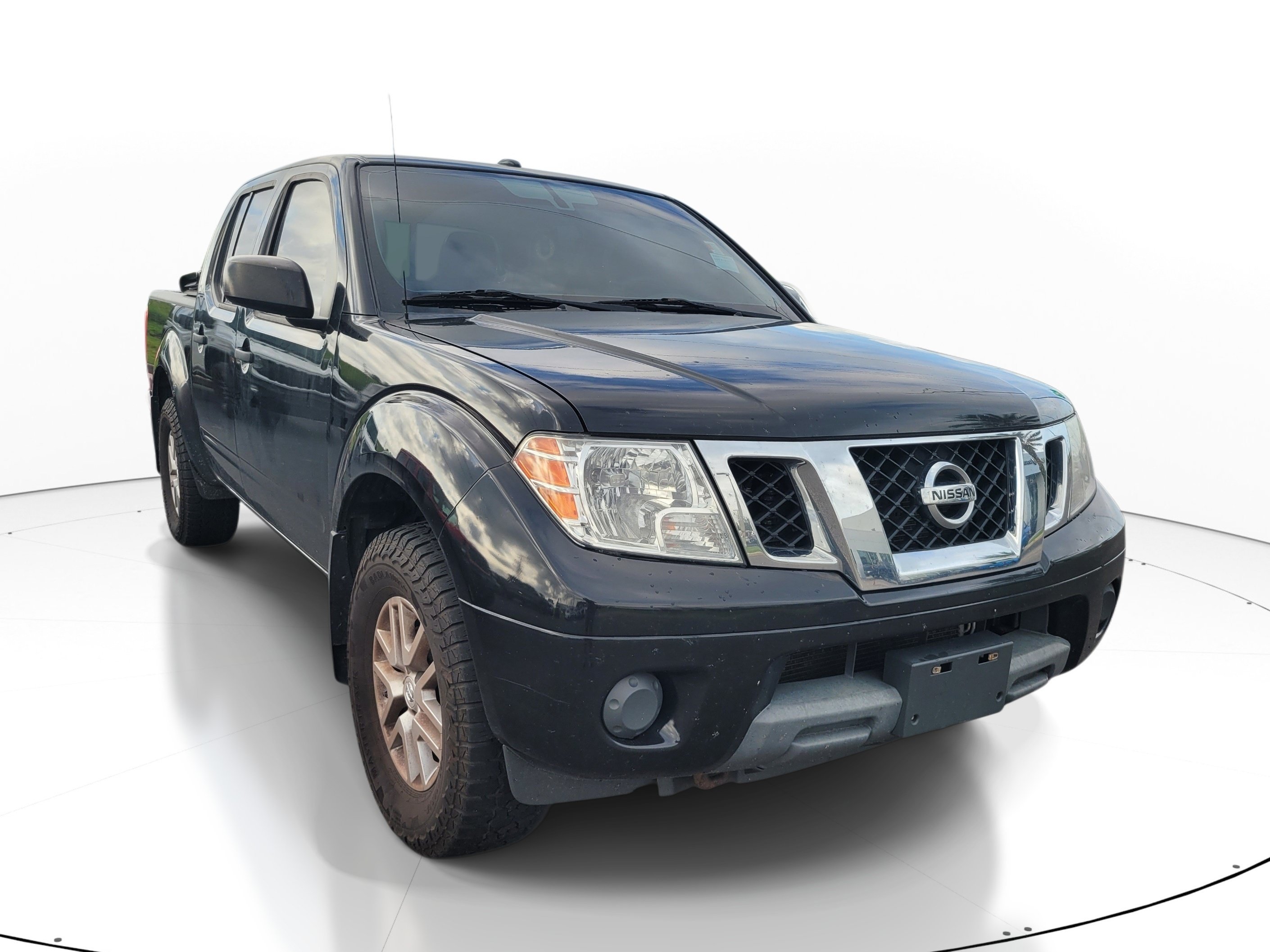 Used 2016 Magnetic Black Nissan SV image 1