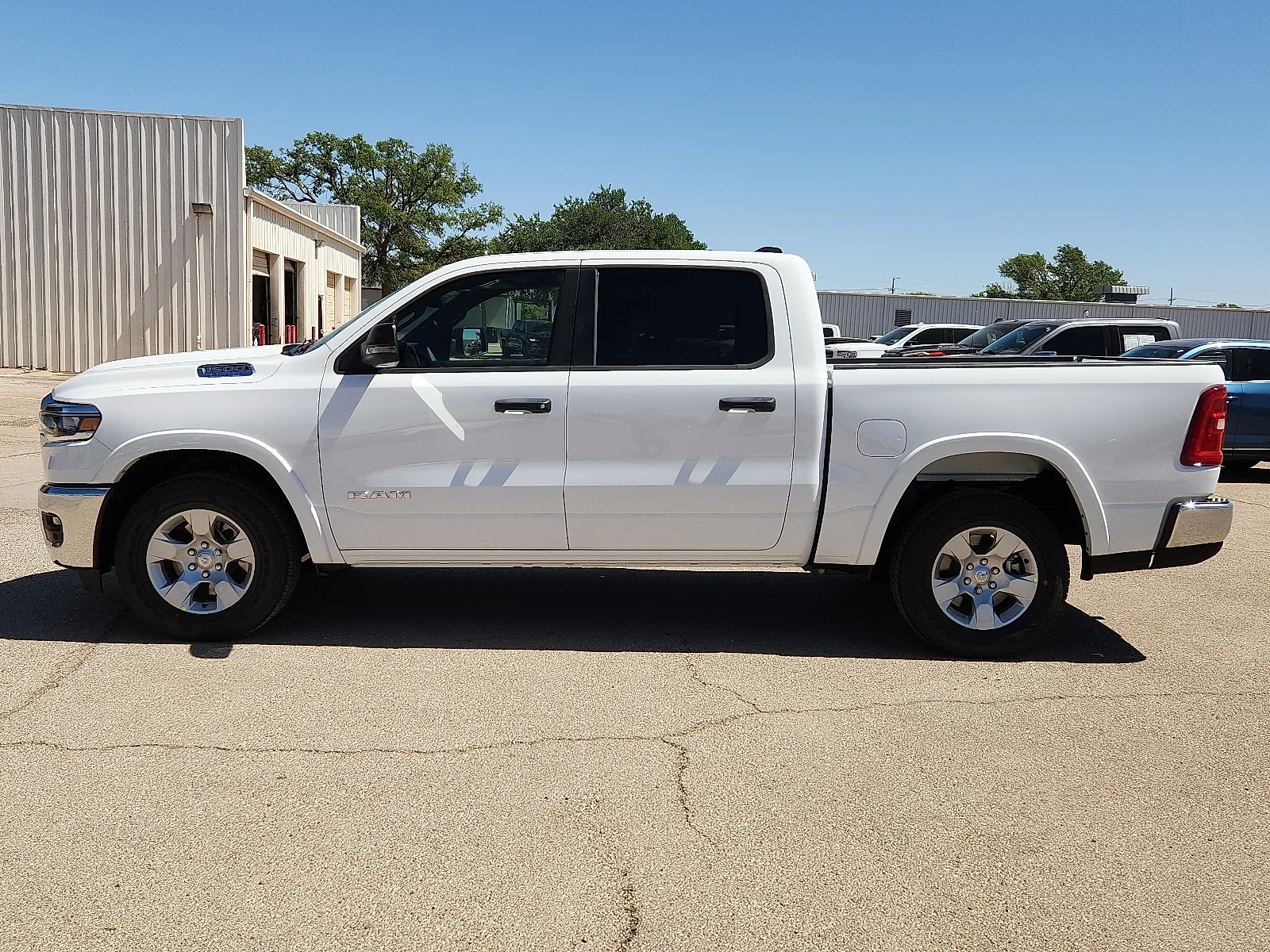New 2026 Bright White Clear-Coat  Paint Ram LONE STAR CREW CAB 4X2 5