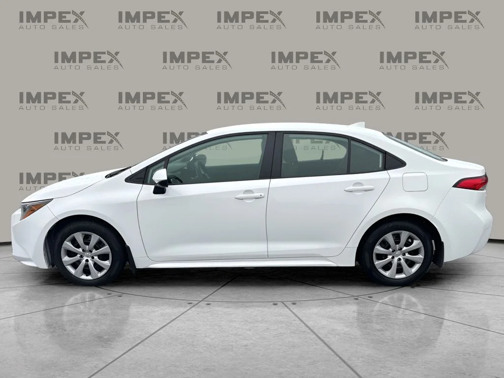 Used 2025 White Toyota LE image 2