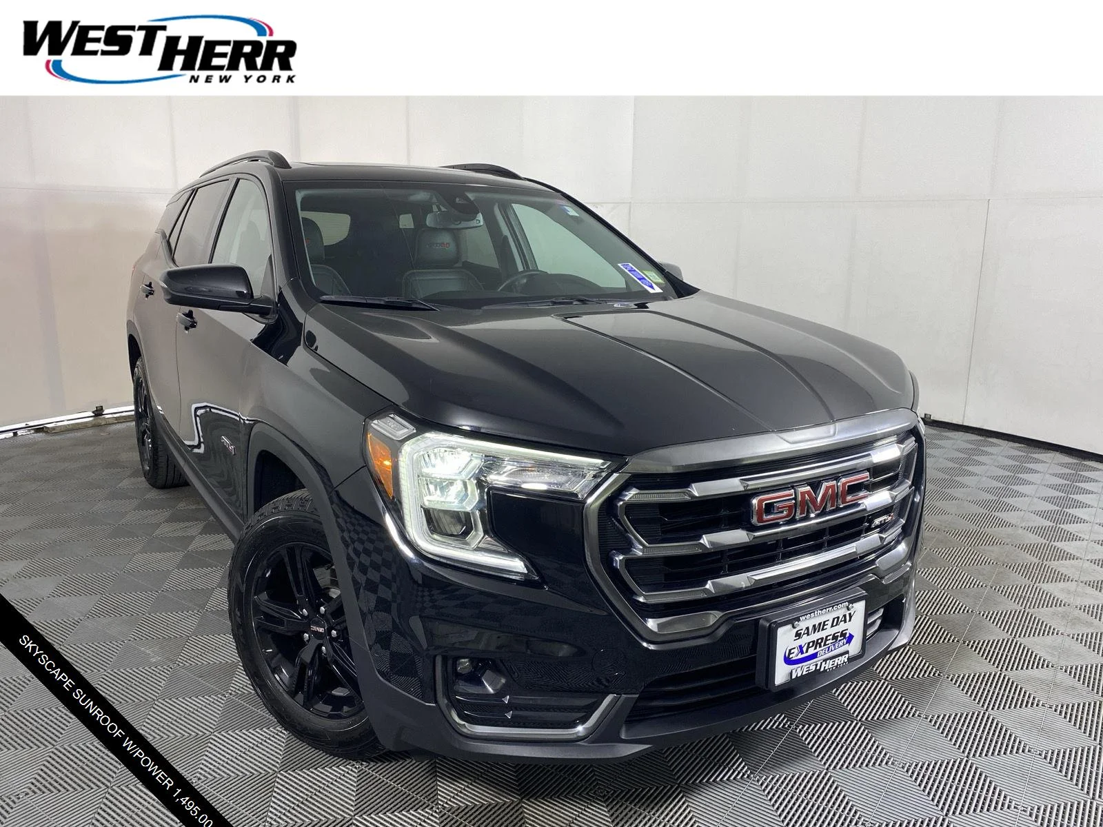 Used 2024 Ebony Twilight Metallic GMC AT4 image 1