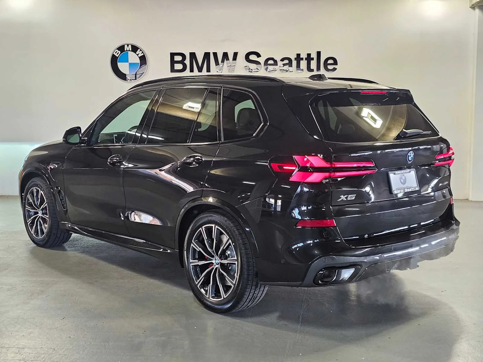 New 2026 Black Sapphire Metallic BMW xDrive50e image 4