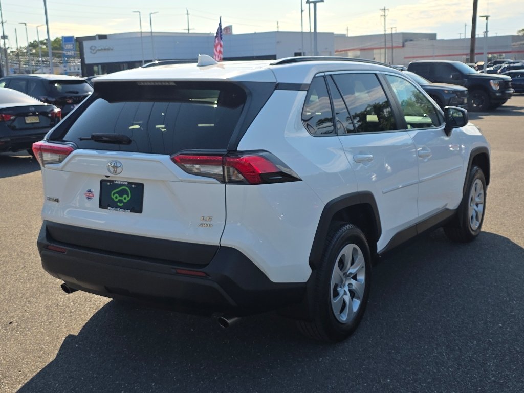 Used 2021 Super White Toyota LE image 13