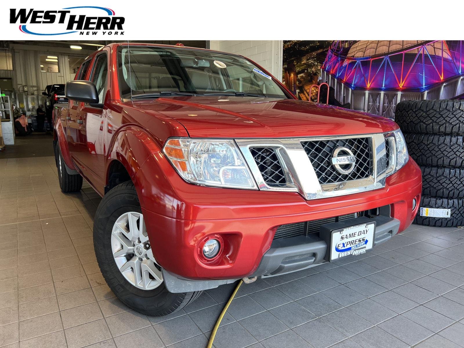 Used 2016 Lava Red Nissan SV image 1
