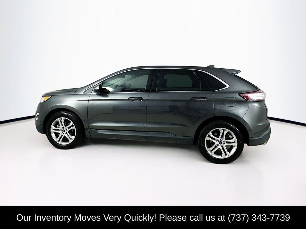 Used 2016 Gray Metallic Ford Titanium image 4