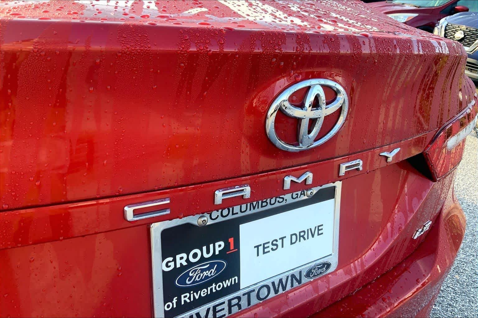 Used 2024 Supersonic Red Toyota LE image 29