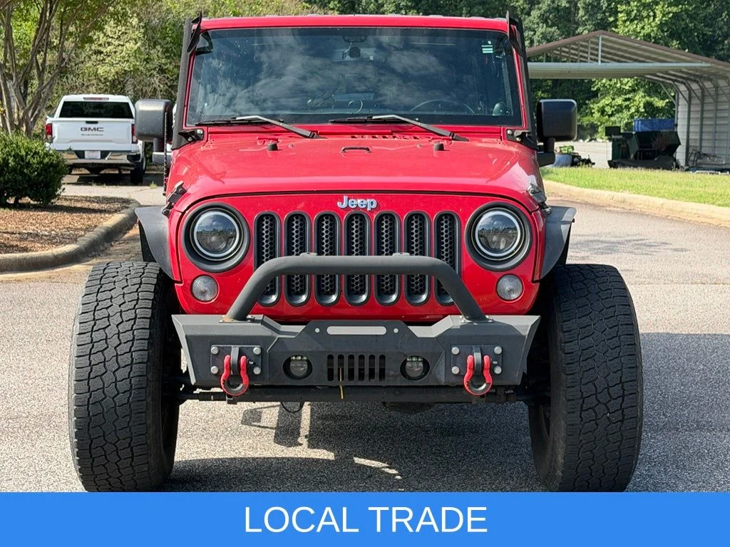 Used 2014 Red Jeep Unlimited Sport image 2