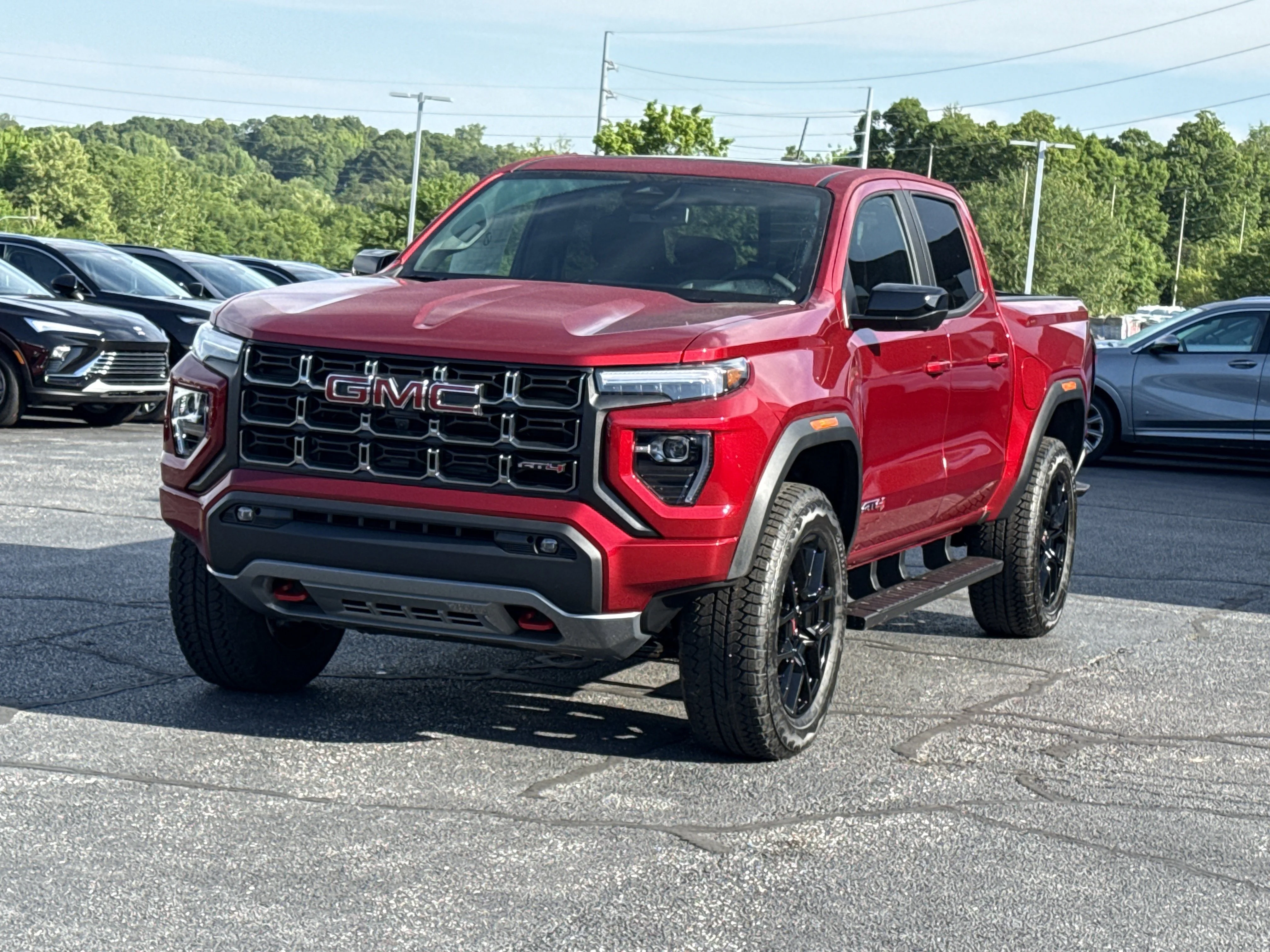 New 2026 Volcanic Red Tintcoat GMC 4WD AT4 image 13