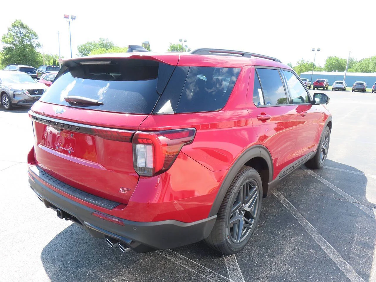 New 2026 Rapid Red Metallic Tinted Clearcoat Ford ST AWD 4dr SUV image 4