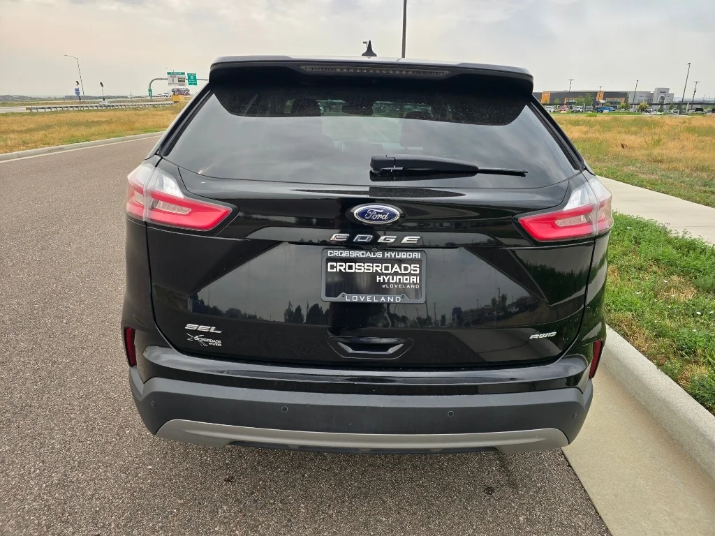 Used 2022 Agate Black Metallic Ford SEL image 4