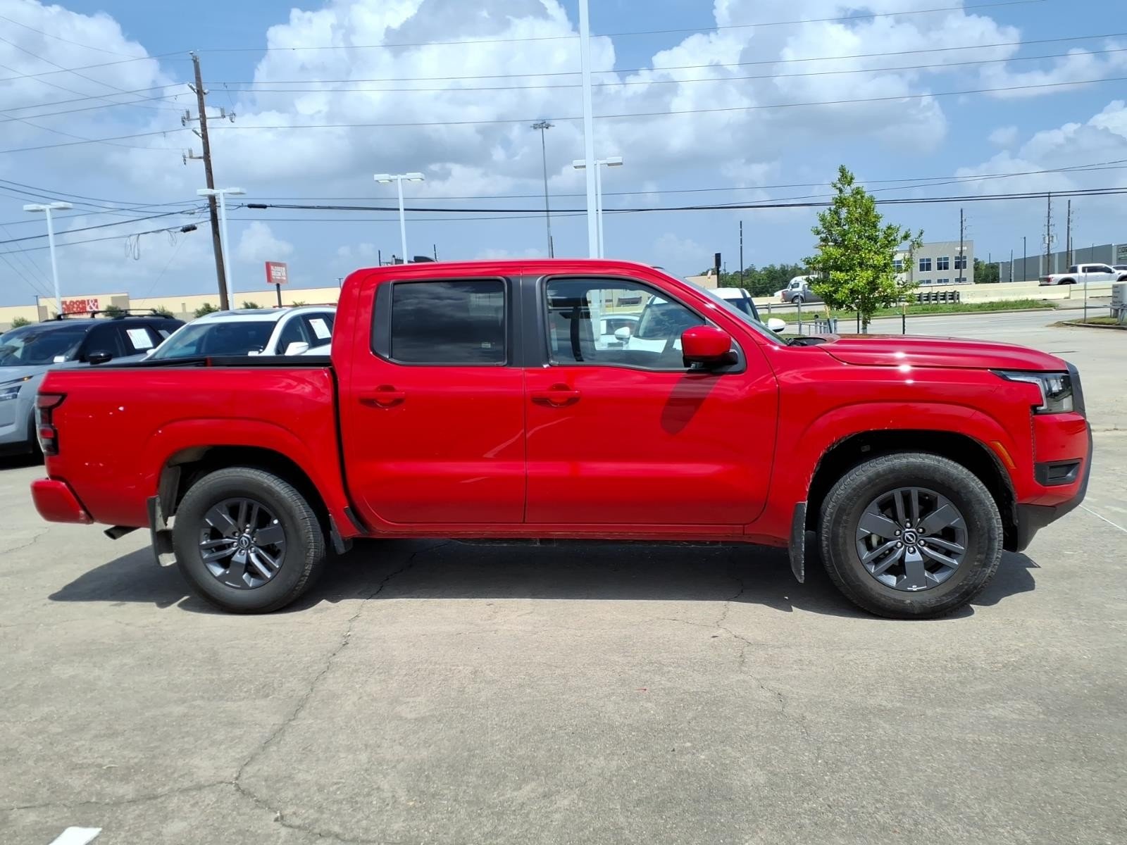 2026 Nissan Frontier SV Red at Robbins Nissan