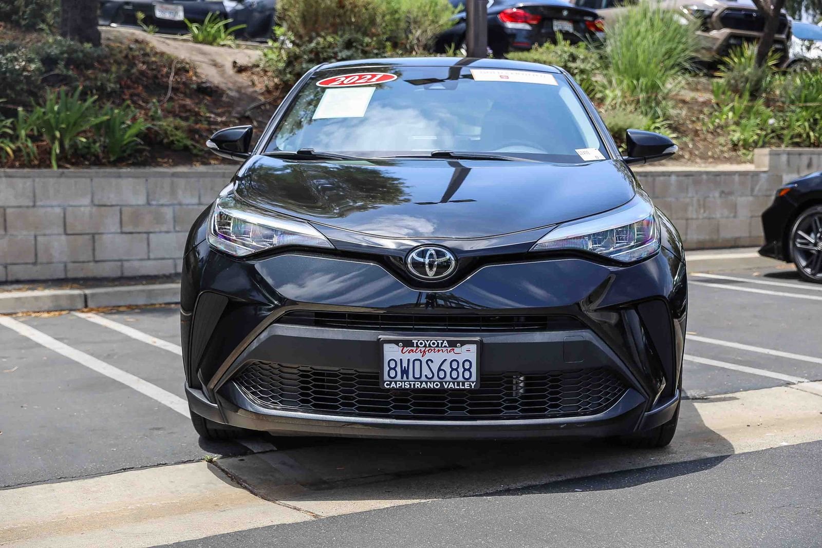 Certified Used 2021 BLACK SAND PEARL Toyota LE image 2