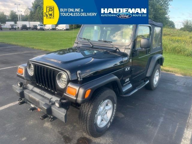 Used 2006 Black Jeep X image 1