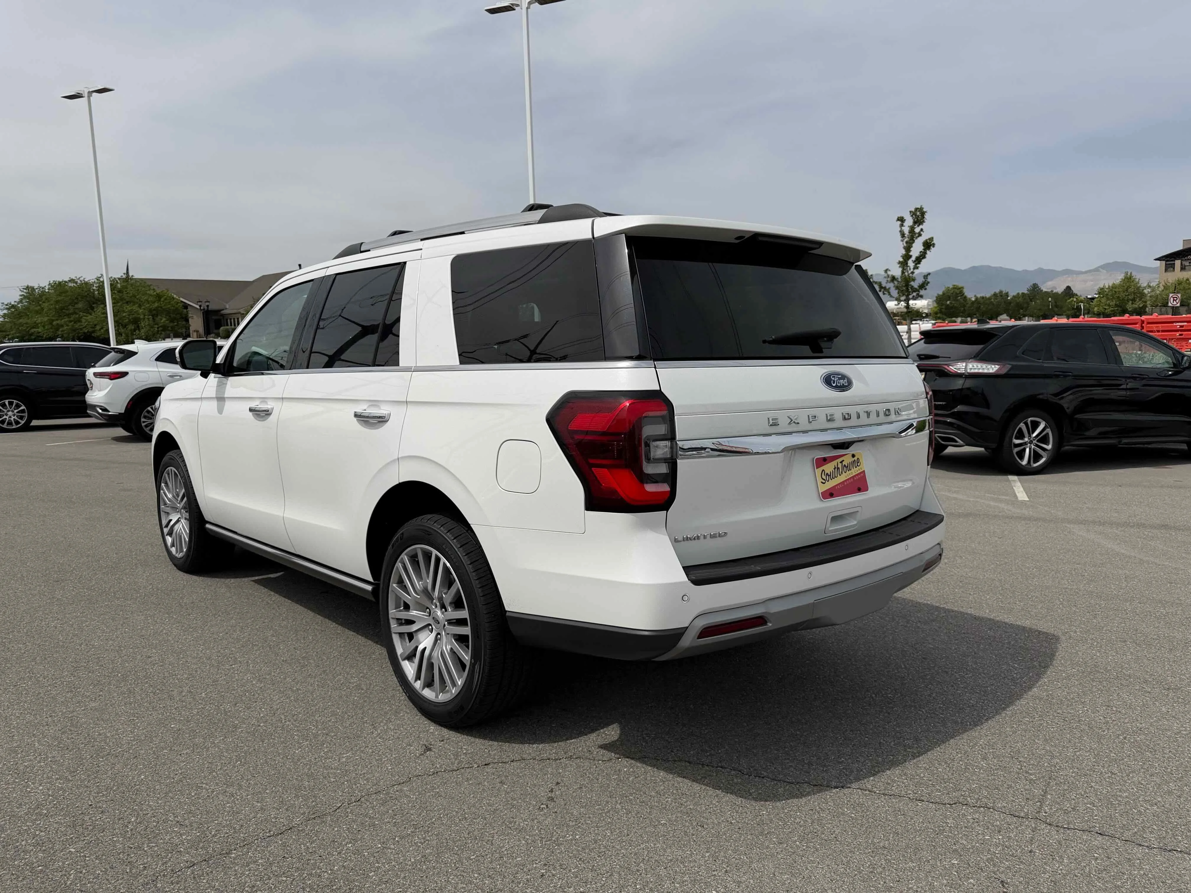 Used 2023 White Metallic Ford Limited image 5