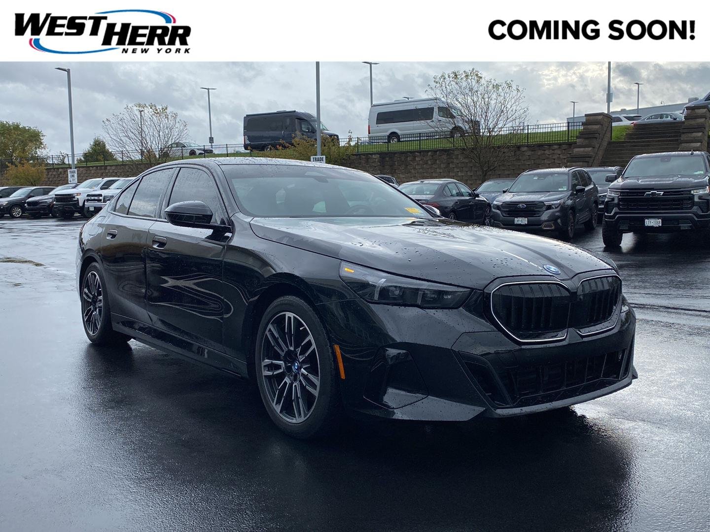 Used 2025 Black Sapphire Metallic BMW 550e xDrive image 1