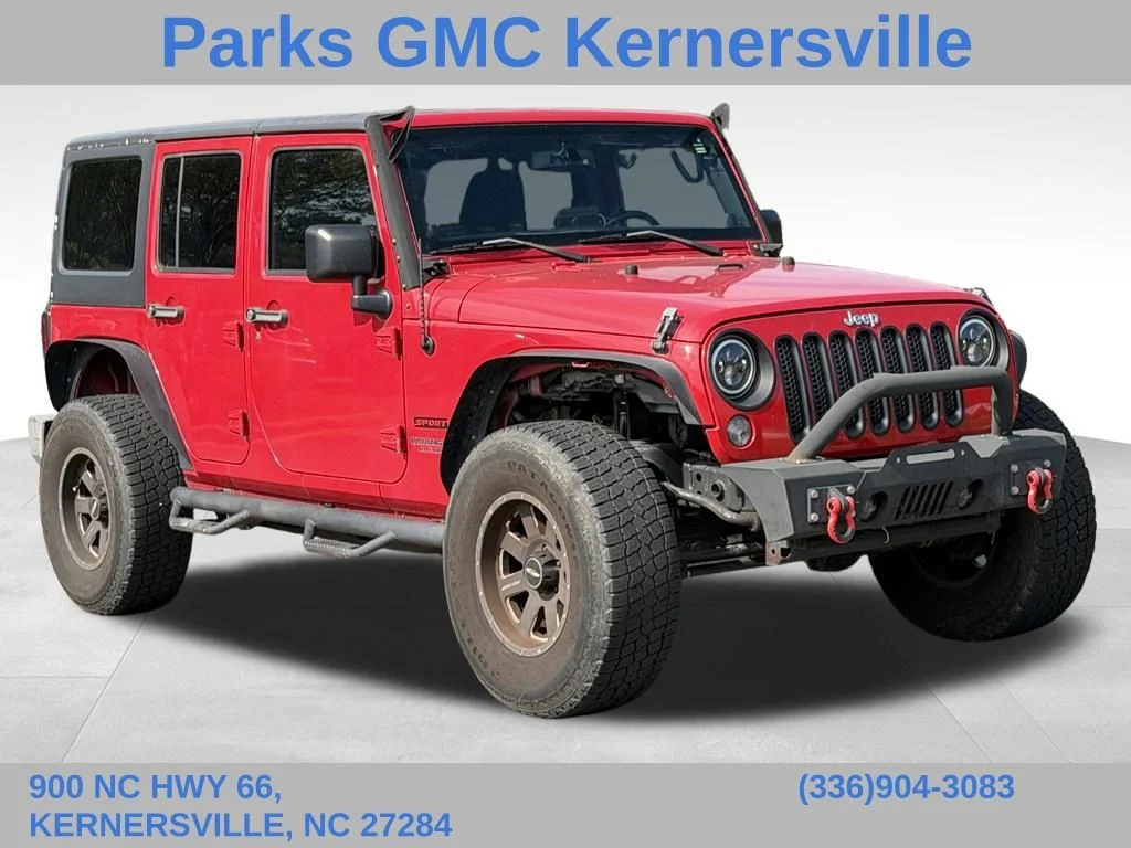 Used 2014 Red Jeep Unlimited Sport image 1