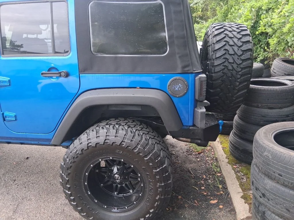 Used 2015 Blue Jeep Unlimited Sport image 15
