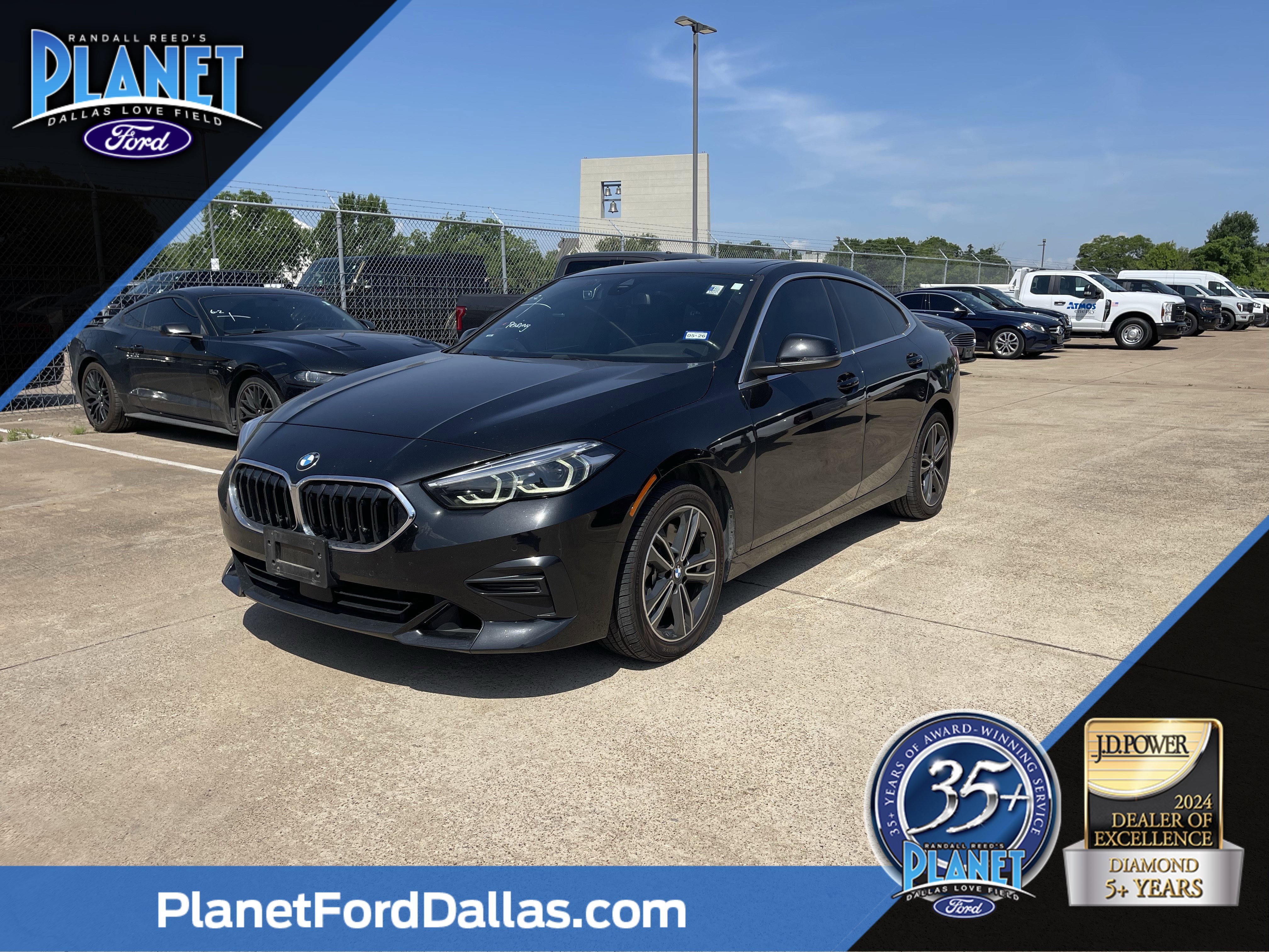 Used 2024 Black Sapphire Metallic BMW 228i xDrive image 1