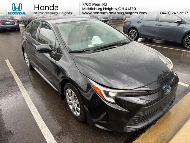 Used 2023 Midnight Black Metallic Toyota LE image 1