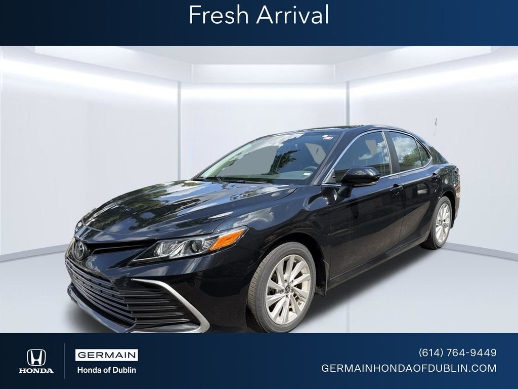 Used 2021 Midnight Black Metallic Toyota LE image 1