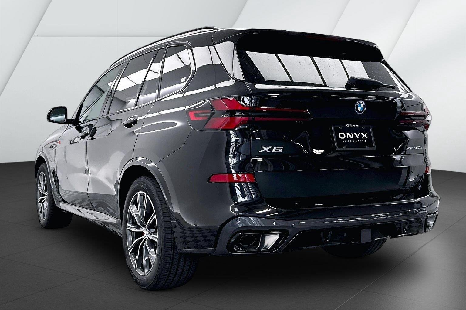 New 2026 Black Sapphire Metallic BMW xDrive50e image 9