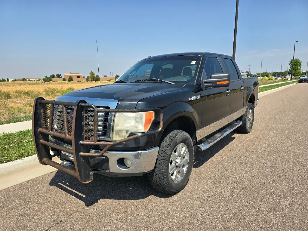 Used 2011 Tuxedo Black Metallic Ford XLT image 1