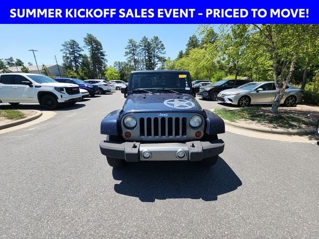 Used 2013 Blue Jeep Unlimited Sport image 4