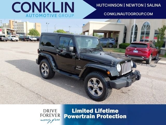 Used 2016 Black Clearcoat Jeep Sahara image 1
