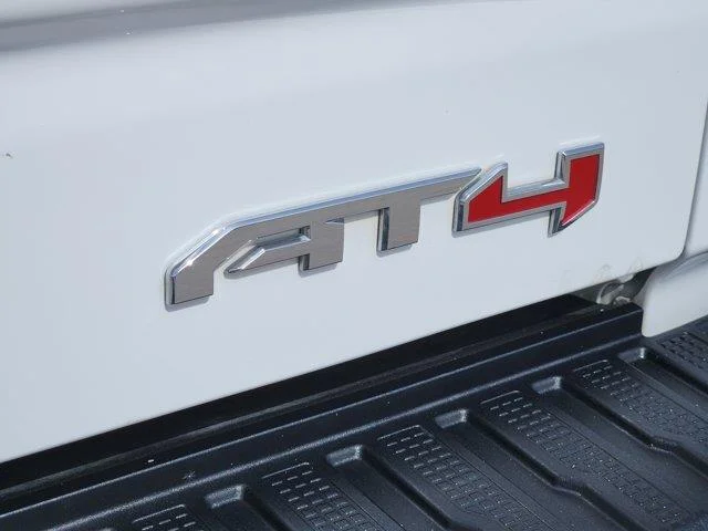 Used 2024 Summit White GMC AT4 4x4 Crew Cab 5.75 ft. box 147.4 in. WB image 11