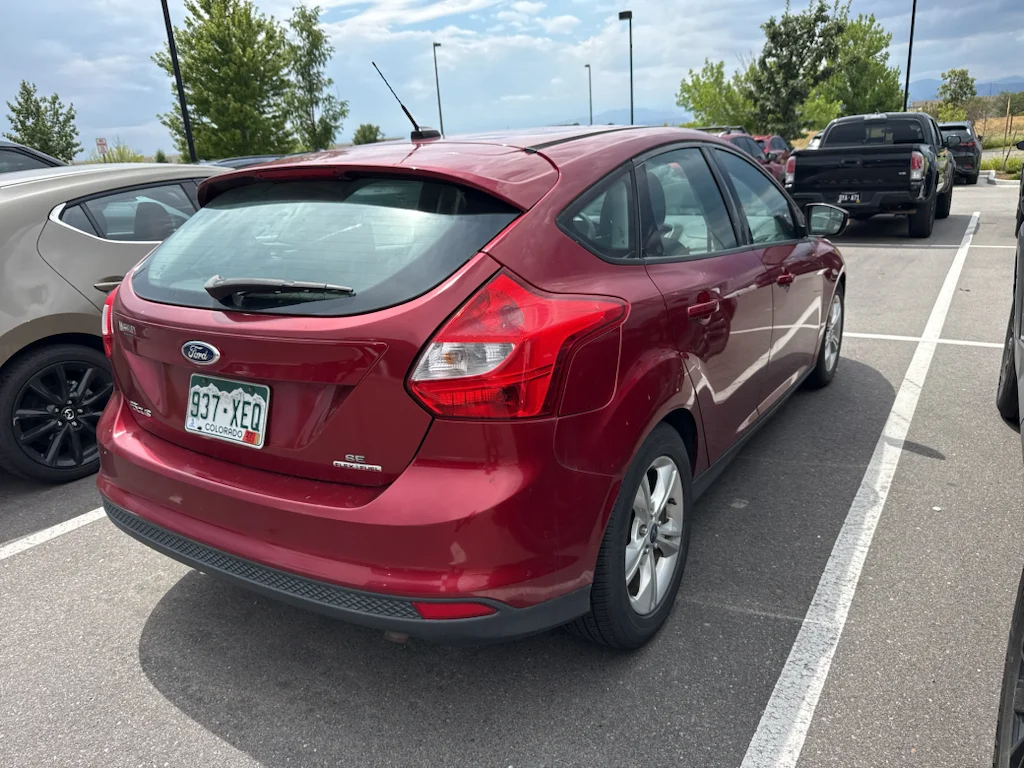 Used 2014 Ruby Red Tinted Clearcoat Ford SE image 4