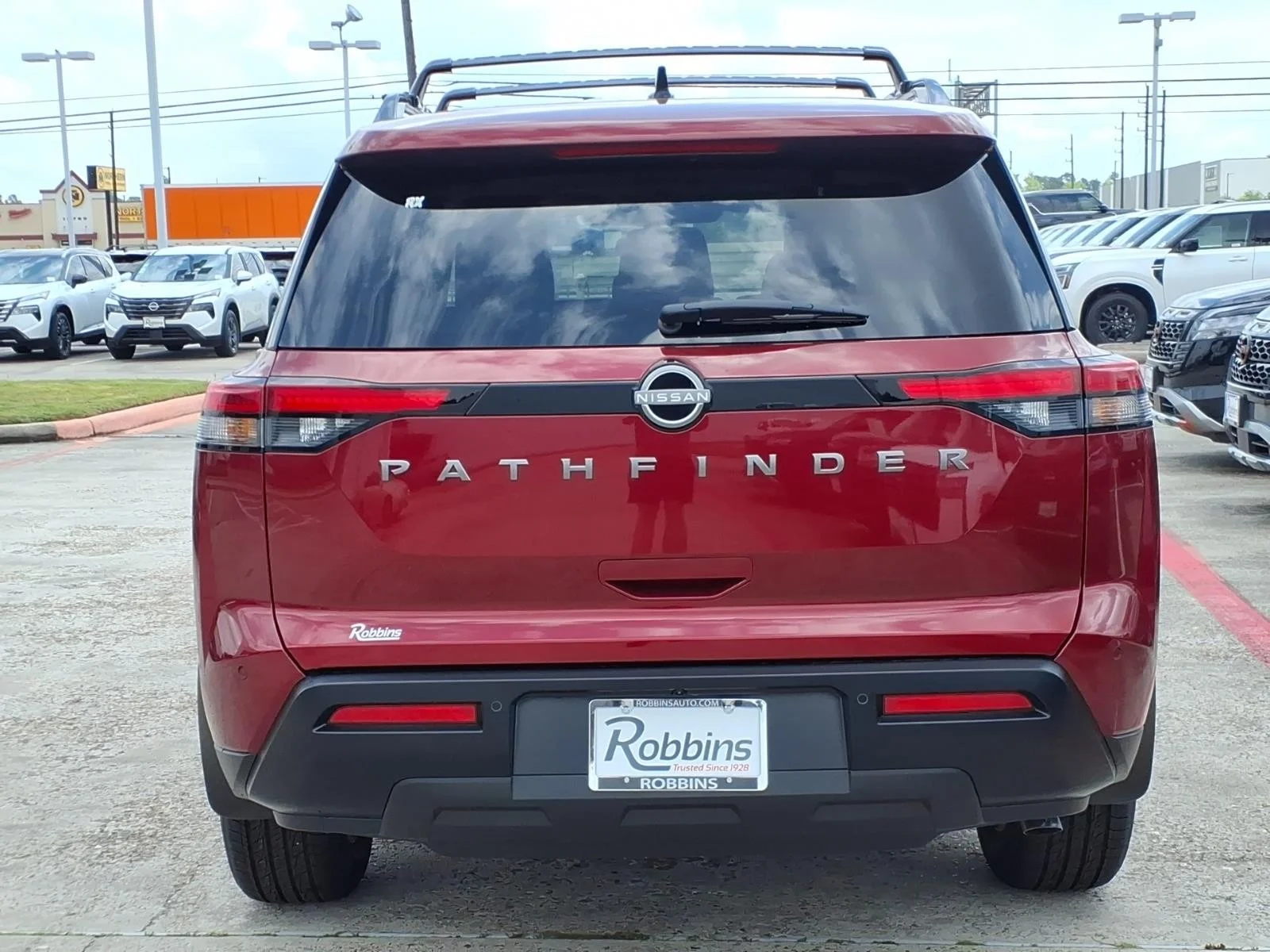 2026 Nissan Pathfinder SV Red at Robbins Nissan