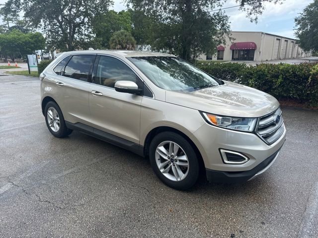 Used 2017 White Gold Metallic Ford SEL image 1