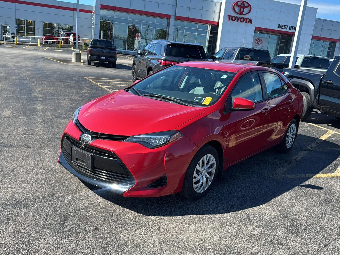 Used 2018 Barcelona Red Metallic Toyota LE image 3