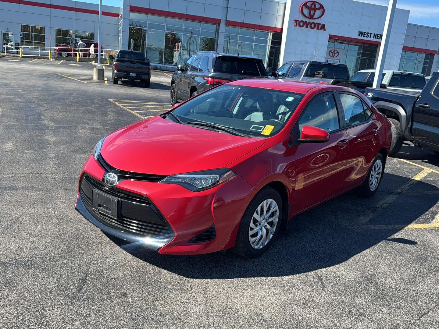 Used 2018 Barcelona Red Metallic Toyota LE image 3